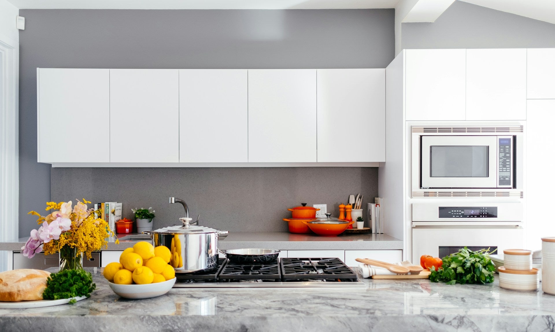 Modern white kitchen with marble island - hero